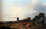 A Panoramic Summer Landscape With Cattle Grazing In A Meadow By A Windmill